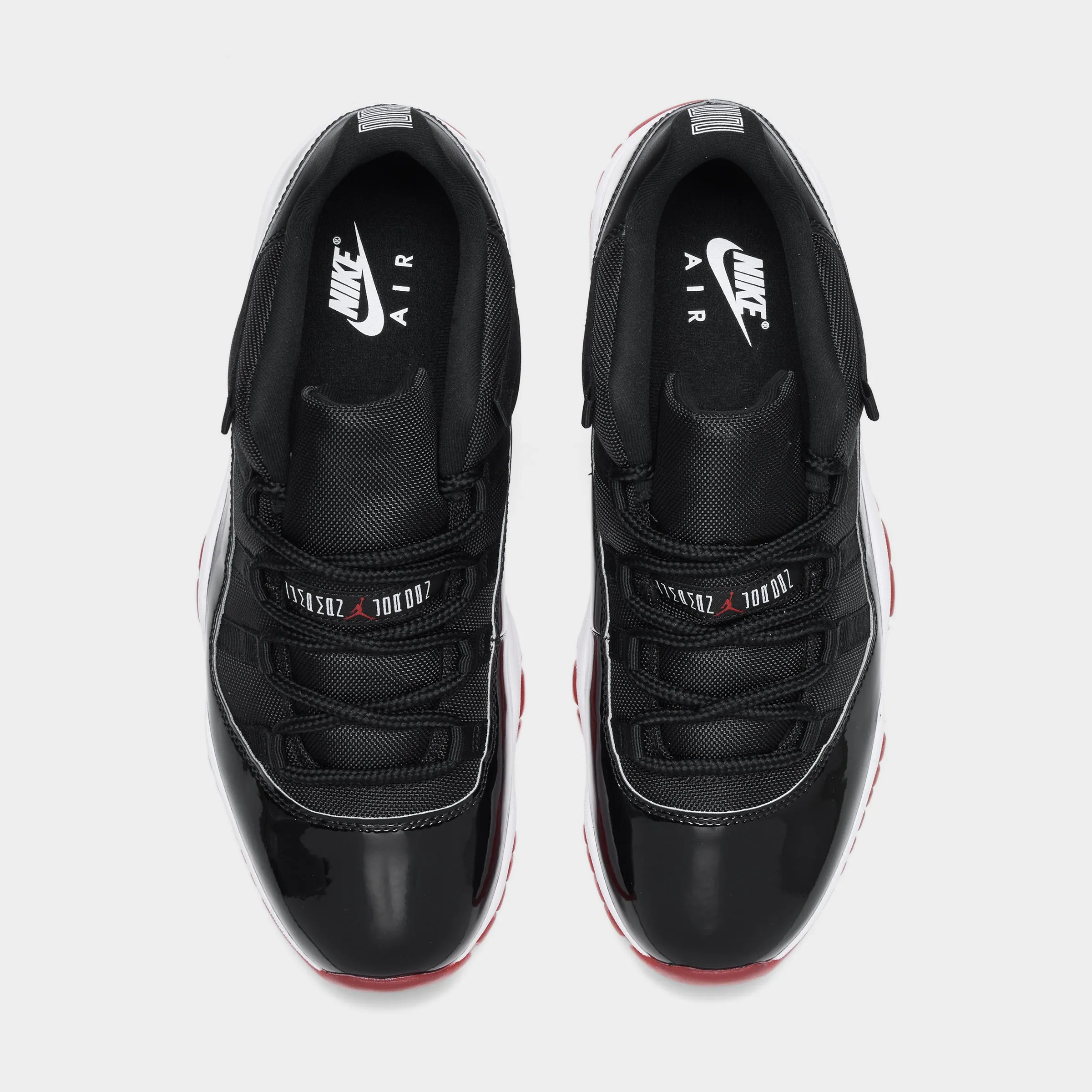 Jordan 11 Retro Low Black / Varsity Red - White Stability Control Mechanism