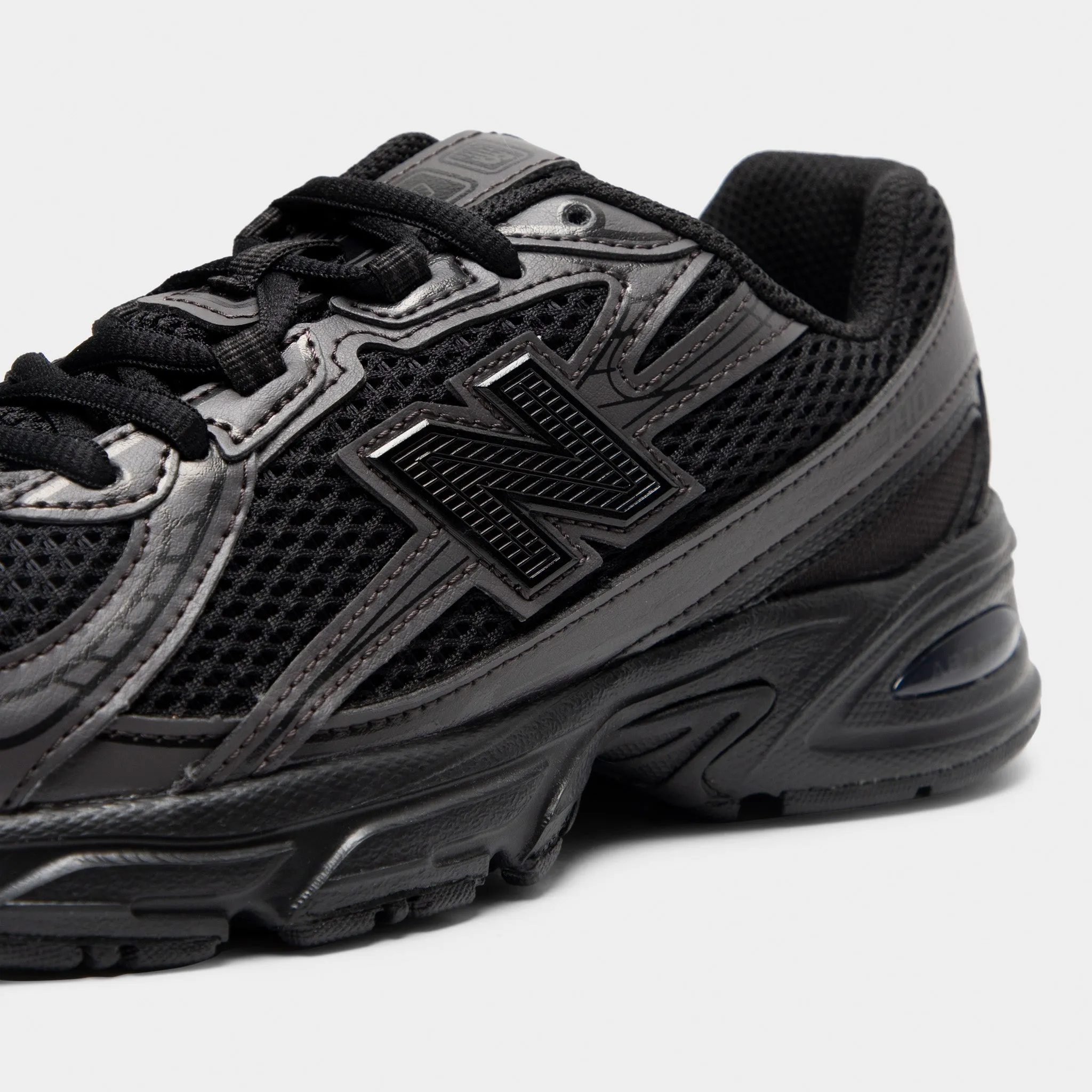 Bold Statement Elegant shock absorption New Balance Juniors' 740 Black Cement / Black
