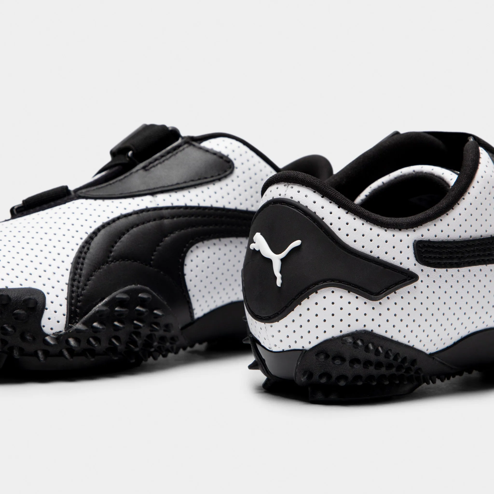 PUMA Women's Mostro Perf White / Black Comfortable Standing Grip Tread Pattern